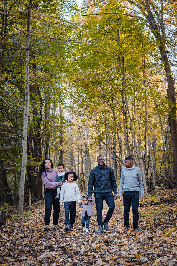 Untitled Families - mom and dad with 4 kids walking through forest