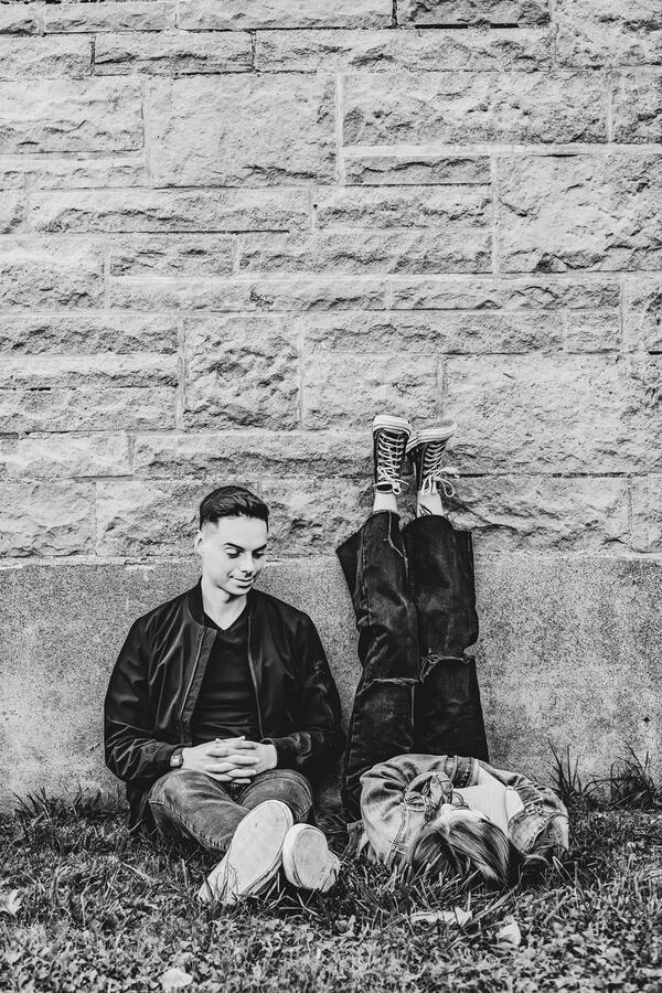 Untitled Family - Brother and sister leaning against a wall