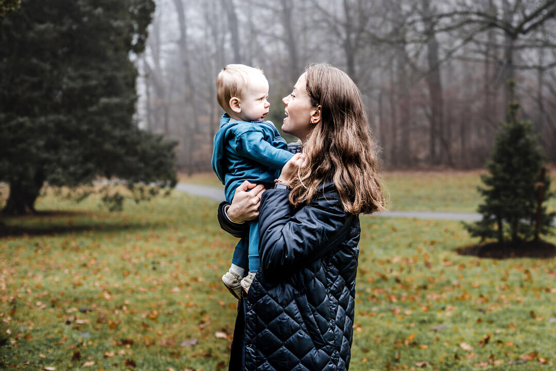Untitled Families - mom holding son in arms, both looking at each other