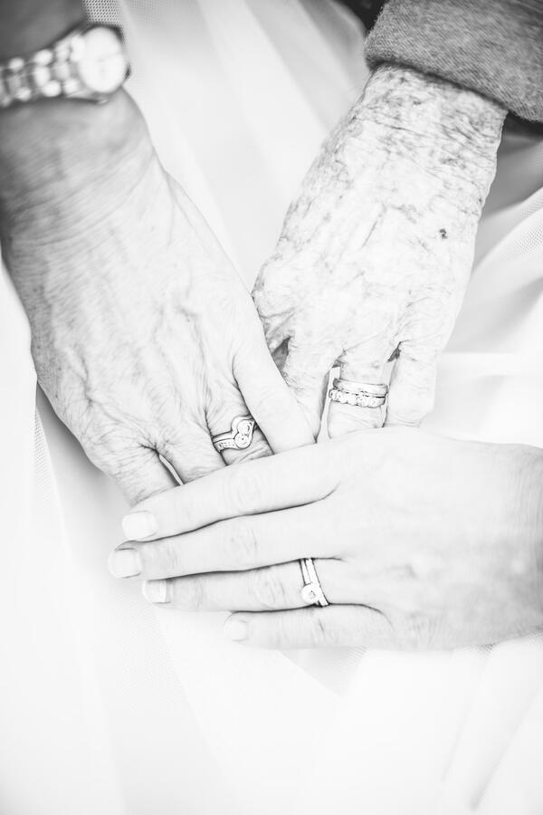 Untitled Three generations of hands & wedding rings: bride, brides' mother, brides grandmother