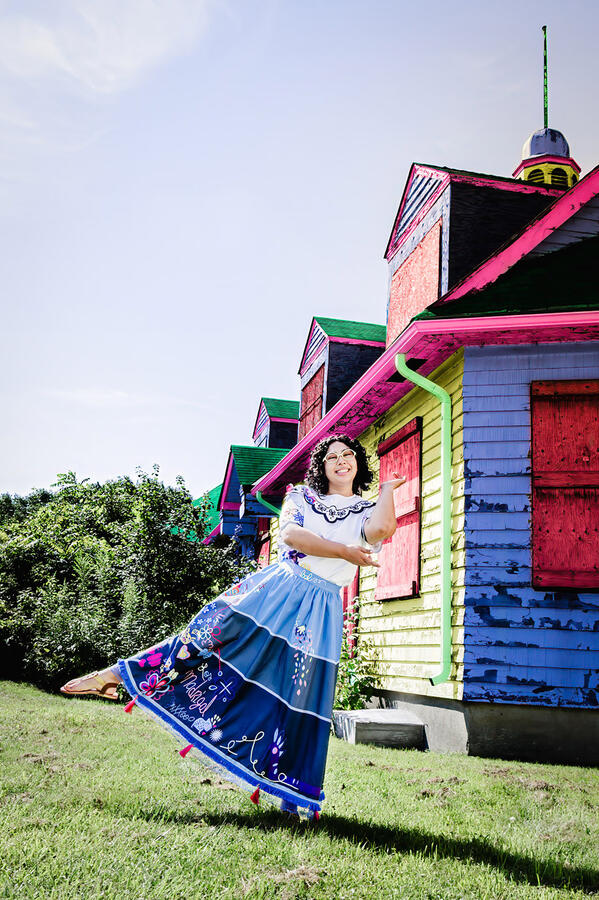 Untitled Styled Shoot - Mirabel cosplay dancing in front of colourful house