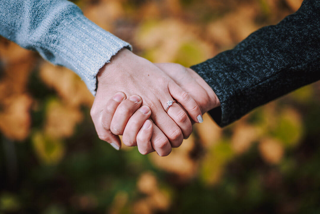 Untitled Couple - holding hands to show off engagement ring