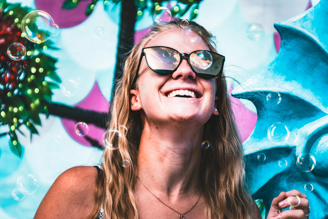 Shannon looking up as bubbles blow around